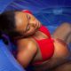 African American Woman Laboring in waterbirth tub From Above