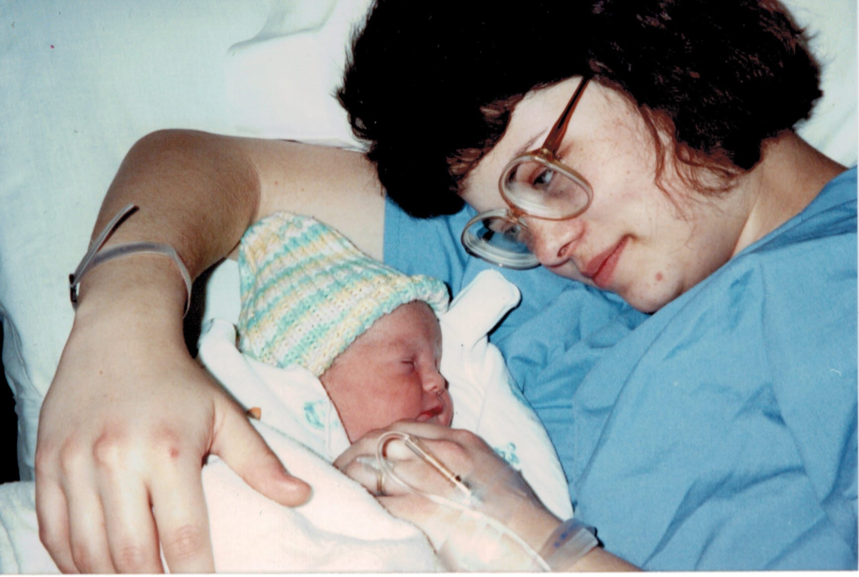 mom looking at her newborn baby