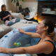 midwife-attending-client-laboring-in-a-tub-of-water