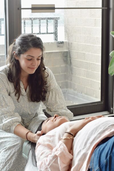 chiropractor-adjusting-a-young-pregnant-woman