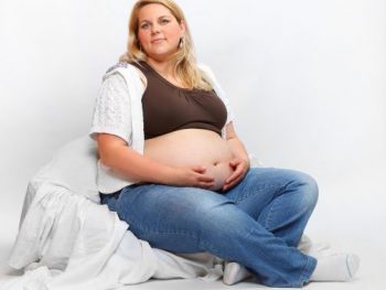 Overweight pregnant woman relaxing
