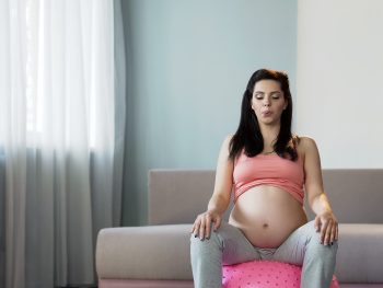 pregnant-woman-laboring-on-birth-ball