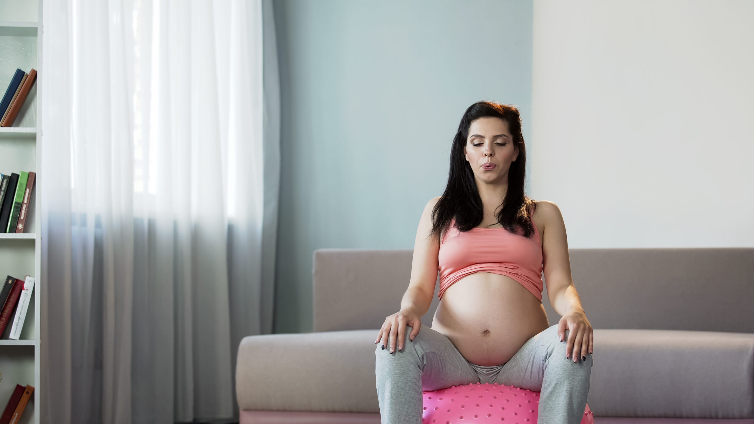 pregnant-woman-laboring-on-birth-ball