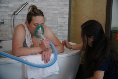 woman-in-labor-using-nitrous-oxide-for-labor-pain-relief-birth-center