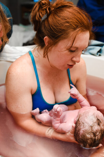 woman holding her baby following a VBAC