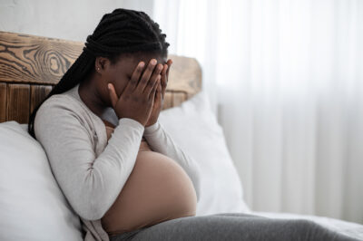 upset-black-pregnant-woman
