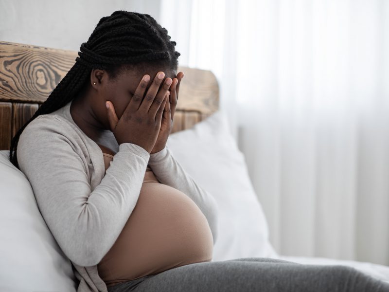 upset-black-pregnant-woman