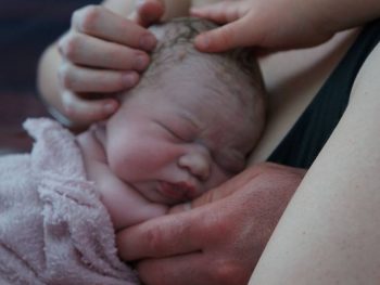 Newborn in mother's arms