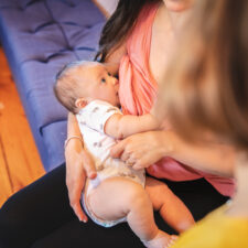 mother-nursing-newborn-with-lactation-consultant