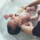 newborn in bathtub